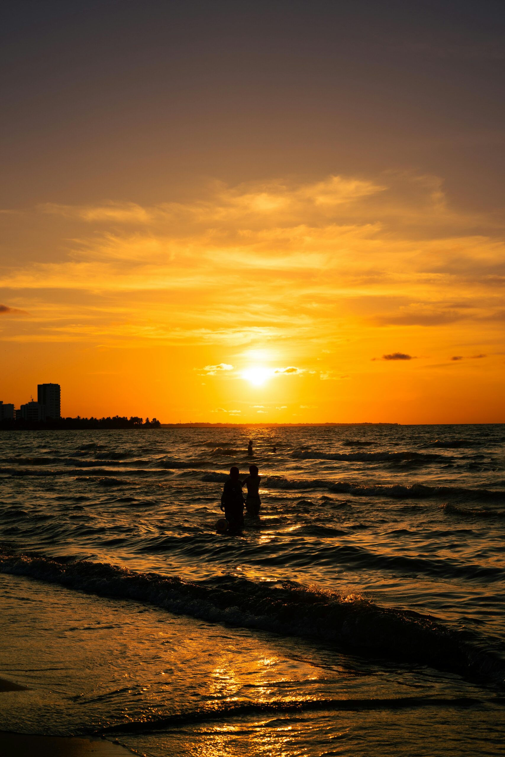 A beautiful silhouette against the breathtaking sunset over Coveñas beach, Colombia.